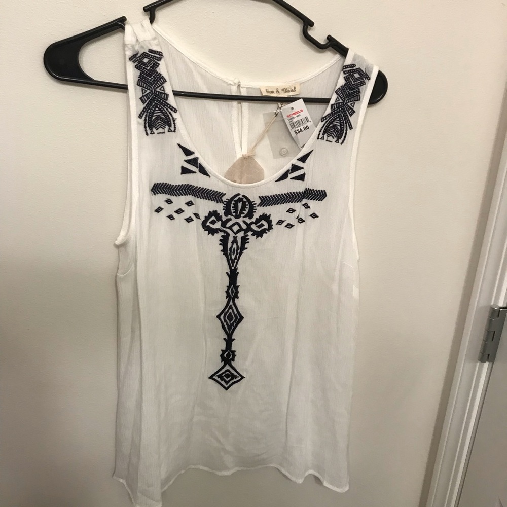 Hem and thread open back tank top